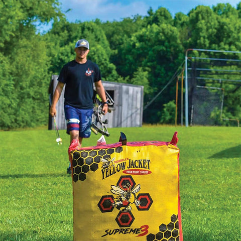 Yellow Jacket Supreme 3 Archery Target Bag Dual Sided 23 By 12 Inches used for compound bow practice in grassy backyard setting