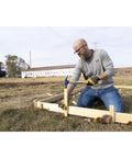Man using Framing Hammer 24oz With Hickory Handle 999 Series Milled Face Made In USA Heavy Duty Demolition Tool for framing work outdoors