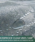 Close-up of Clear PVC Waterproof Tarp Cover, Built Tough As Nails 20 Mil Tarpaulin With water droplets on surface.