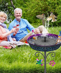 Metal Bird Bath For Outdoors Freestanding Garden Bowl With Vintage Look Ideal Yard Decor For Wild Birds And Hummingbirds Gradient Purple Finish Easy Assembly Durable Weatherproof Exterior Centerpiece with birds and people in the background