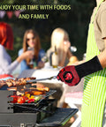 Person wearing Heat Resistant Grill Gloves With Non Slip Silicone Grip For Oven And Barbecue cooking at grill