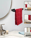 Black hand towel holder with red towel in bathroom setting.