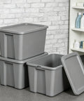 Straight Up Tough As Nails Heavy Duty Plastic Storage Bin With Secure Snap On Lid For Real Garage Setup Or Home Decluttering Projects Gray 18 Gallon Capacity stacked and unstacked gray bins with lids on a floor.