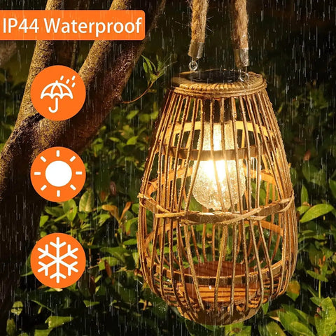 Outdoor Solar Rattan Lantern With Handle For Hanging Or Table Use, Cozy Chill Edison Bulb Glow For Patio Yard Garden Wedding Or Home Decor, Auto On Off, Style 1 in rain showcasing IP44 waterproof feature.