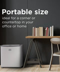 Compact Upright Freezer One Point Two Cubic Feet Portable Chill Station Ample Snack Storage Adjustable Leveling Legs Crisp White Exterior in office corner