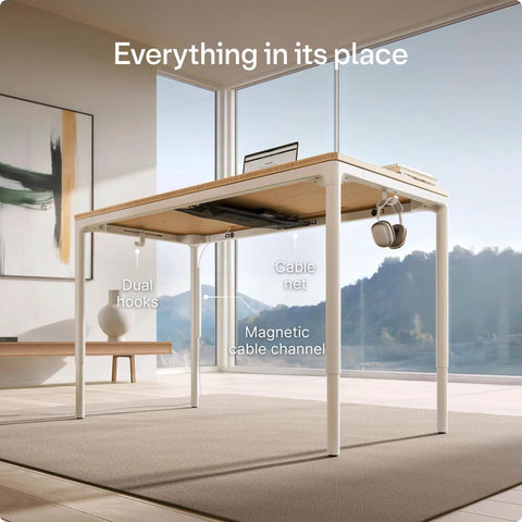 Rock Solid Electric Standing Desk Gliding Smoothly On Ultra Quiet Quad Motors Sixty Three Inch Worktop showcasing dual hooks and cable management.
