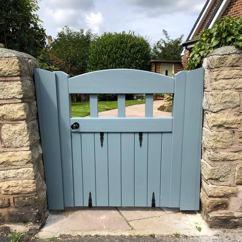 Built Tough Heavy Duty Matte Black Barn Door Pull Handle Solid Zinc Alloy Ring Knob For Sliding Doors Fences Gates Shutters And Patios on a blue garden gate.