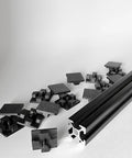 End Cap Set For 2020 Aluminum Extrusion Profiles, 25 Pieces, 20mm By 20mm Black Plastic End Caps, Snug Fit With Four Point Contact For Superior Grip, Beefier Than Competitors, Will Not Break Easily, Made In USA, shown with 20x20mm extrusion profile