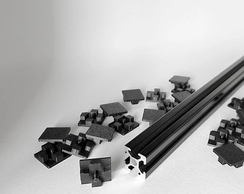 End Cap Set For 2020 Aluminum Extrusion Profiles, 25 Pieces, 20mm By 20mm Black Plastic End Caps, Snug Fit With Four Point Contact For Superior Grip, Beefier Than Competitors, Will Not Break Easily, Made In USA, shown with 20x20mm extrusion profile