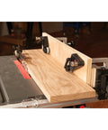 Kickass Flex Stock Guide For Portable Table Saw Featuring Slick Rollers And Fast Height Setup For 8 Or 10 Inch Blades on a woodwork setup.