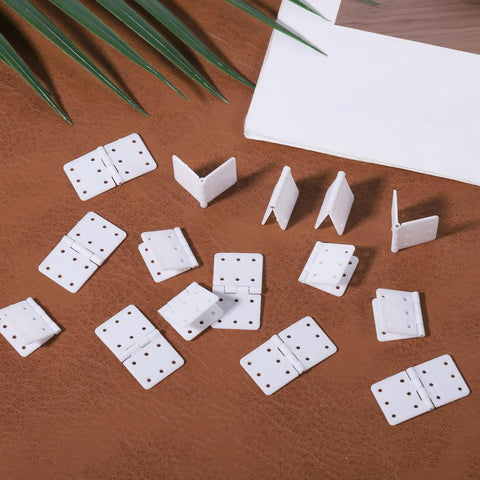 Folding Nylon RC Plane Hinges Kit for Fixed Wing Models 20 Pcs Square Leaf Hinges for Remote Control Aircraft displayed on a table.