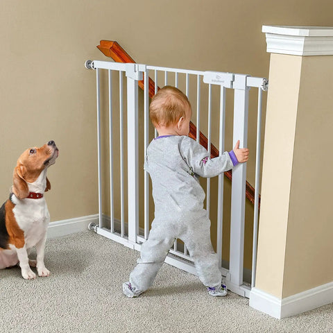 Child and dog behind Extra Wide Baby Gate For Stairs And Doorways 27 To 43 Inches Auto Close Safety Gate With Extenders Pressure Or Hardware Mount Kit Easy Install 30 Inch Tall White