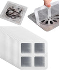 Lcarege Disposable Hair Drain Stickers, 60 Pack 4x4 Fiberglass covers shown applied over drain with hair collected.