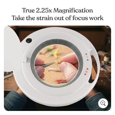 Close-up view of LightView Pro Magnifying Floor Lamp with Stand focusing on detailed craft work through 5D glass magnifier lens.