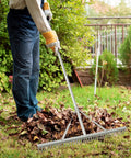 Person using a 36 Inch Aluminum Landscape Rake With 36 Tines And 68 Inch Non Slip Handle For Easy Soil Loosening And Leveling Backyard Yard Rake Tool For Leaves Lawn Care Garden Cleanup And Beach Maintenance