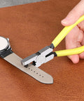 Leather Hole Punch Plier 2.0mm Universal Hole Punch Tool For Watch Straps shown punching a hole in a leather watch strap on a brown surface