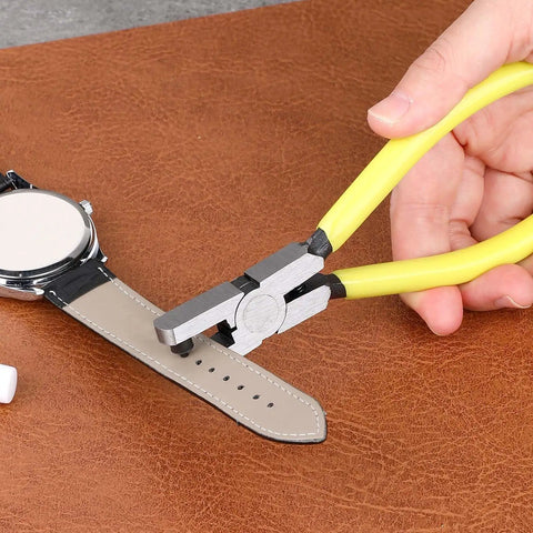 Leather Hole Punch Plier 2.0mm Universal Hole Punch Tool For Watch Straps shown punching a hole in a leather watch strap on a brown surface