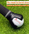 3 Prong Golf Ball Retriever Grabber With Back Saver Claw Put On Putter Grip, holding a golf ball on grass.