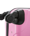 Close-up of pink carry-on luggage with spinner wheels