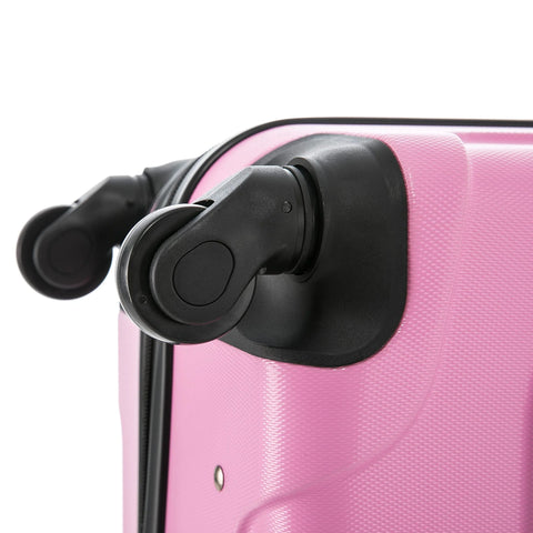 Close-up of pink carry-on luggage with spinner wheels