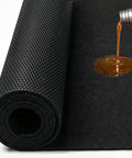 Heavy Duty Oil Spill Mat For Garage Floor 3x5 Ft Extra Thick Absorbent With Anti Slip Rubber Backing Reusable Under Car Leak Pad shown with oil spill