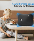 Compact Mini Safe Box For Home And Dorms With Key Lock next to child, ideal for securing valuables, black, 0.23 cubic feet, kid-friendly design.