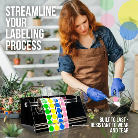 Rock Solid Acrylic Label Dispenser With Grippy Non Slip Base Keeps Your Sticker Rolls Tied Down Tight in use for labeling plants.