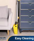 Commercial Broom And Dustpan Set With 54 Inch Long Handle For Indoor Outdoor Cleaning near a gray sofa and blue dresser