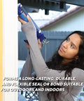 Side view of a person using a caulk gun to apply black Rutland 500°F RTV high-heat silicone sealant outdoors