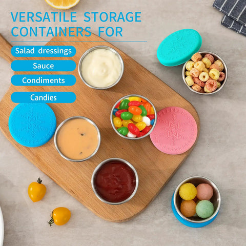 Six Pack Two Point Four Ounce Stainless Steel Dressing Containers With Silicone Lids filled with various sauces and snacks