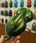 Celadon Green Automotive Basecoat Paint Gallon 128 Oz Ready To Spray sample in hand, showcasing vibrant color and metallic finish.