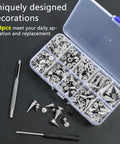 Open box of 359 Piece Punk Spikes And Studs Kit In Zinc Alloy Silver Cone Spikes And Rivets with tools on black surface