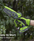 Compact 24V Brushless Mini Chainsaw Electric Pruning Saw For Tree Branch Trimming held by a gloved hand in green, ideal for easy cutting.