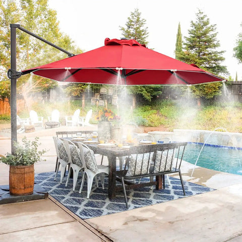 Outdoor patio with red umbrella misting, showcasing 10 Pack Solid Brass Misting Nozzles For Outdoor Cooling System Replacement Nozzles For One Quarter Inch Tubing Patio Backyard Garden Greenhouse Mister Accessories Create Fine Mist With 20 To 40 Inch Coverage Up To 20 Degrees Cooler over dining area by pool.