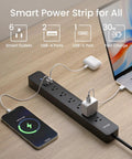 The Real Deal Smart Plug Power Strip With Six Individually Switched Outlets And Three Usb Ports Offering Thirty Watt Fast Charge Surge Protector Alexa And Google Home Compatible Energy Monitor Six Foot Cord on a desk.