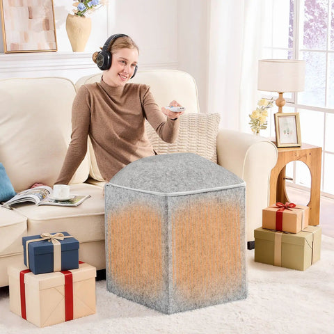 Woman using Under Desk Foot And Leg Warmer Space Heater Portable Quiet Personal Heater for home office, gray, with gifts nearby.