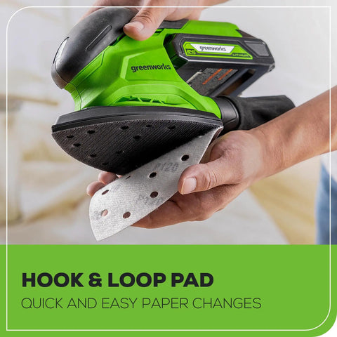 Cordless 24V Mouse Detail Sander With 11,000 OPM being prepared for use with hook and loop pad attachment.