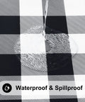Close-up of Round Picnic Tablecloth With Elastic Edges Waterproof Fitted Vinyl Cover in black and white buffalo plaid, resisting water.