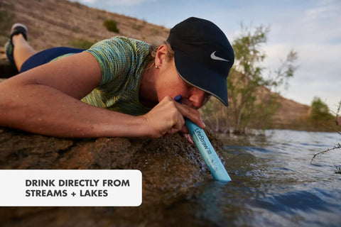 Person using Personal Water Purifier For Hiking Camping Travel And Emergency Prep Delivers Safe Drinking Water By Filtering Out Bacteria Parasites And Microplastics So You Can Stay Ready For Any Backcountry Adventure, drinking from stream