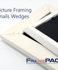 Heavy Duty V Nails For Hardwood Picture Frames And Tight Corner Wedges To Secure Your Woodwork featuring v nails in a white frame close-up.