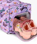 Purple butterfly-print kids' rolling luggage bag with front shoe compartment; pink sneakers inside