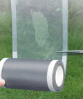Heavy Duty Window Screen Repair Tape being cut for Mosquito Screens Tents And Patio Nets Easy Peel And Stick Patch Kit in use.