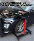 Adjustable Mobile Work Table 32 To 50 Inches Height And Angle Adjustable near a car, holding tools, in a garage setting.