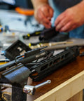 Action Rod Alignment Tool For Gunsmithing, One Piece Aluminum With Steel Contact Design, mounted on workbench