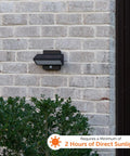 Architectural Outdoor Solar Wall Light With Motion Sensor on brick wall, aluminum bronze finish, compact size, daylight conditions