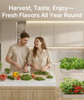 Couple in kitchen using 2 Tier Indoor Hydroponics Growing System Kit With 24 Pods And Full Spectrum Grow Lights, Smart Controller