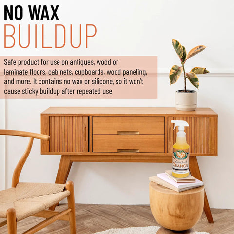 Bottle of Orange Oil Wood Cleaner and Polish Spray on a wooden cabinet, promoting no wax buildup on floors and furniture.