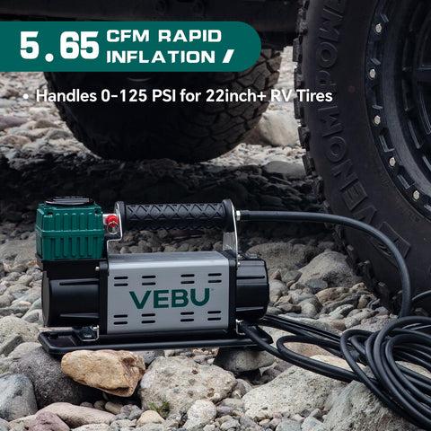 12V Tire Inflator With In Line Pressure Gauge, 125 PSI Fast Inflation For Off Road Rigs next to an SUV tire on rocky ground