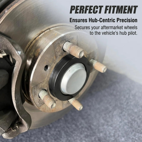 Heavy Duty 4 Pcs Car Wheel Hub Center Rings Reducer Adapters 73.1 Mm To 64.1 Mm Plastic Centric Rings installed on vehicle hub.