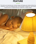 Child sleeping next to a glowing lamp, showcasing product effect of Yellow Amber Bug Light Bulbs For Outdoor Porch And Indoor Hallways A15 5W LED 450 Lumens E26 Edison Base 40W Equivalent Bug Repellent Night Light Bulbs 4 Pack.